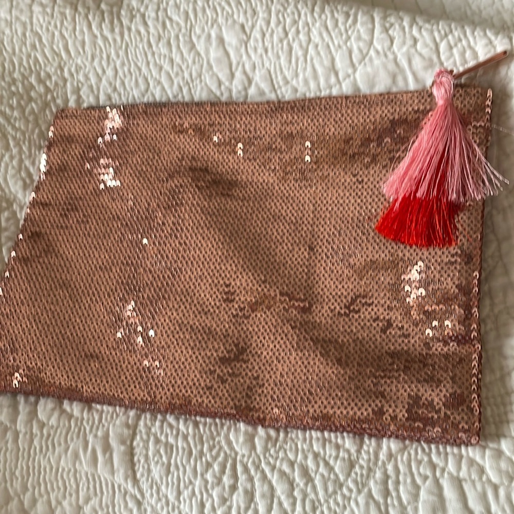 TARTE Pink sequence bag with tassel